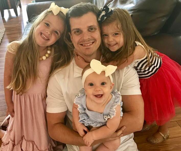 A picture of me and my daughters from 2018